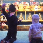 Two children throw balls at cans at the Basler Herbstmesse