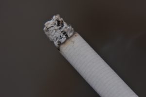 Burning cigarette in Basel to quit smoking